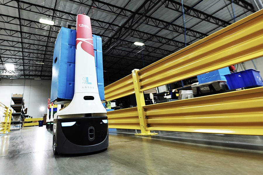 Robot being used to transport boxes at a fulfillment center