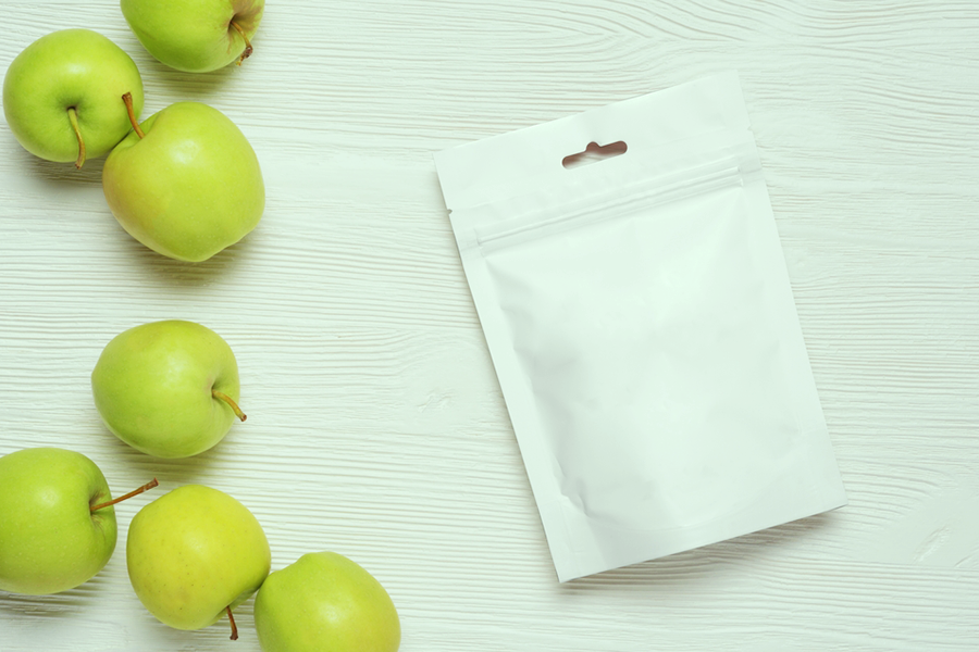 flexible packaging next to green apples