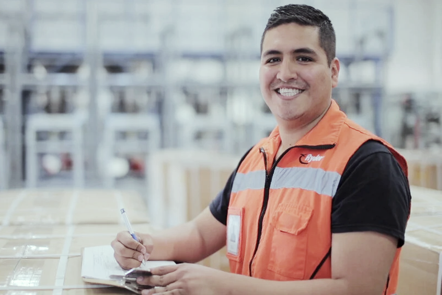 employee at distribution center taking notes