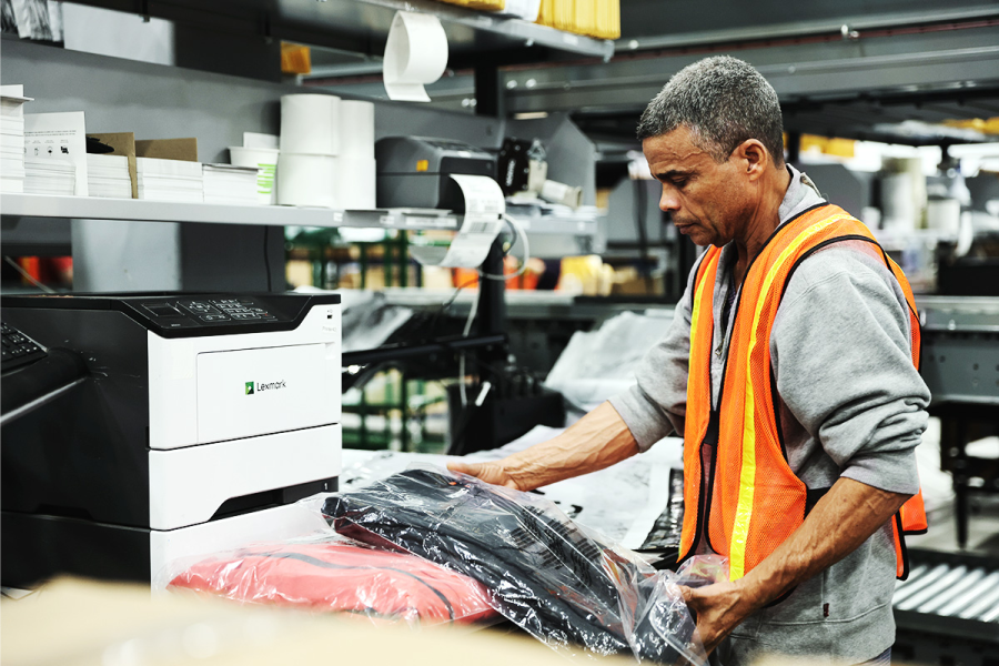 quality assurance worker inspecting product